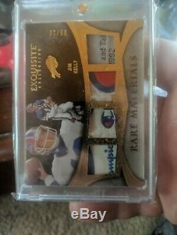 2009 Exquisite Jim Kelly Quad Logo Tags used jersey #9/10 Champion Rare material